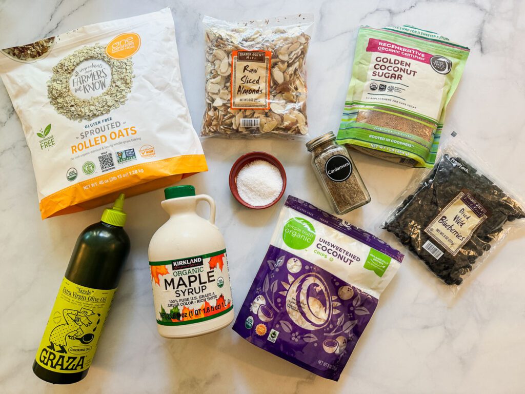 Ingredients for Salty-Sweet Blueberry Almond Granola arranged on a countertop
