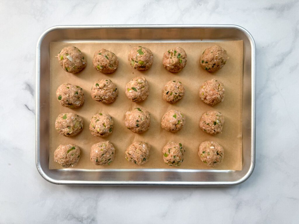 Thai Red Curry Meatballs formed and ready to go in oven