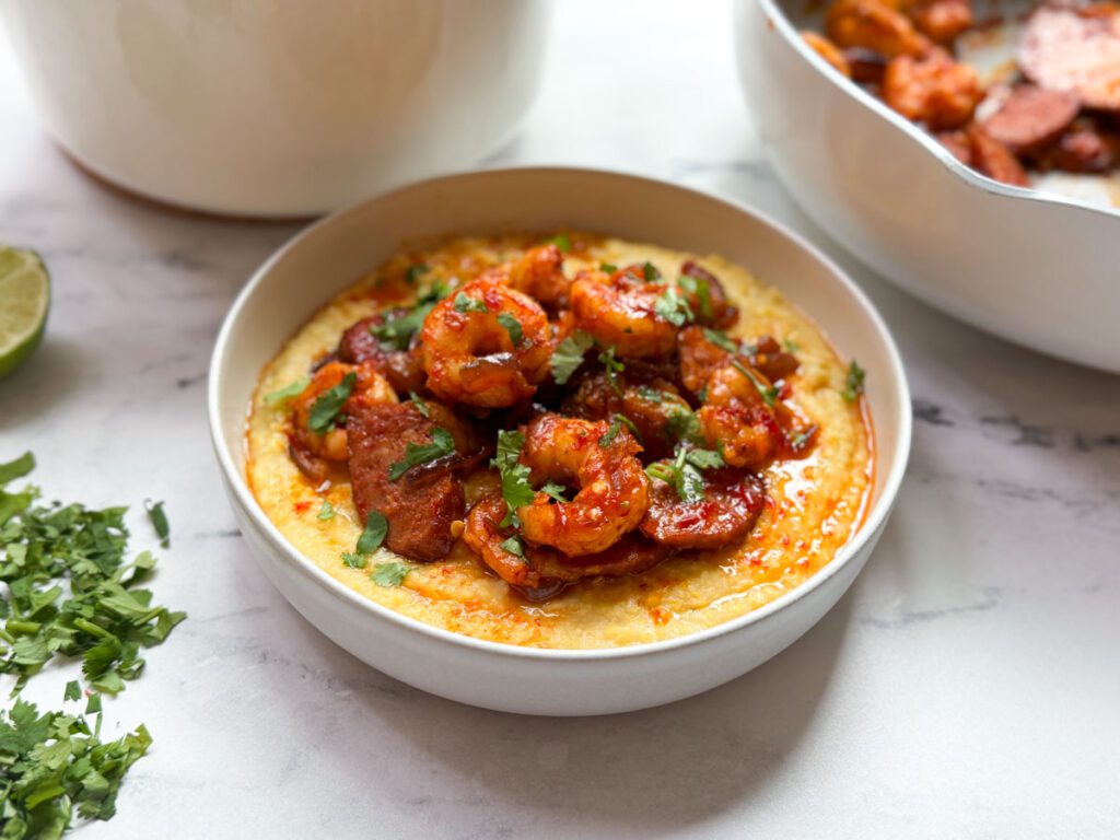 harissa shrimp and sausage served over creamy polenta