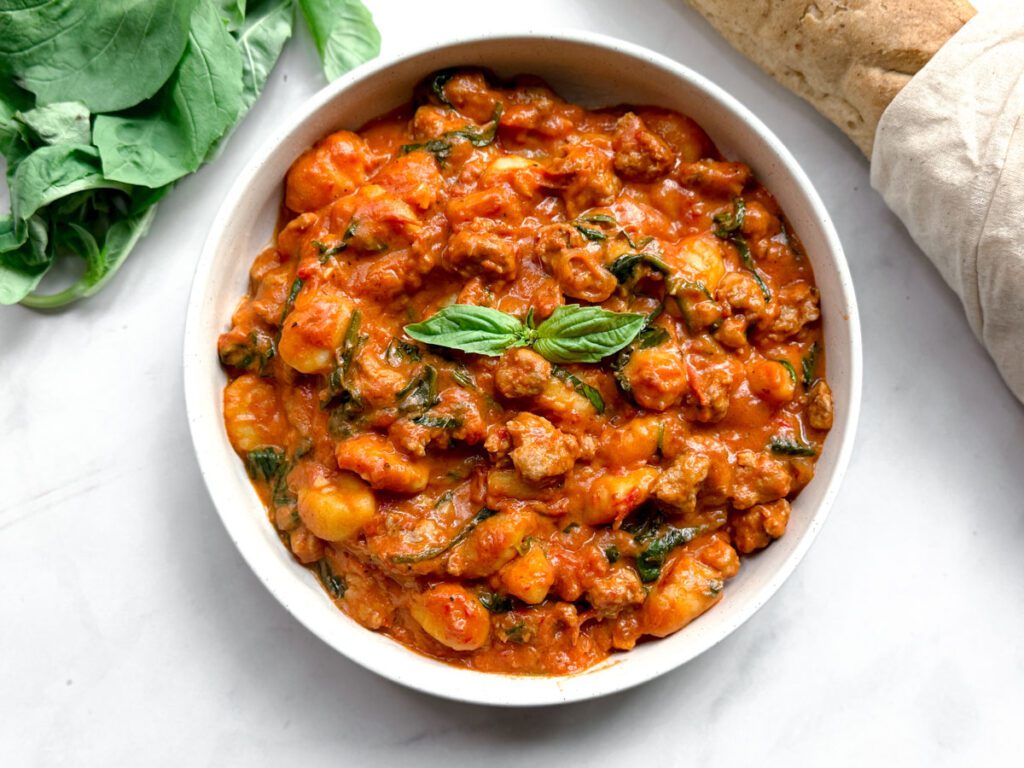 spicy sausage gnocchi served in a bowl